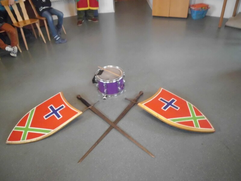 a drum and shields on the floor
